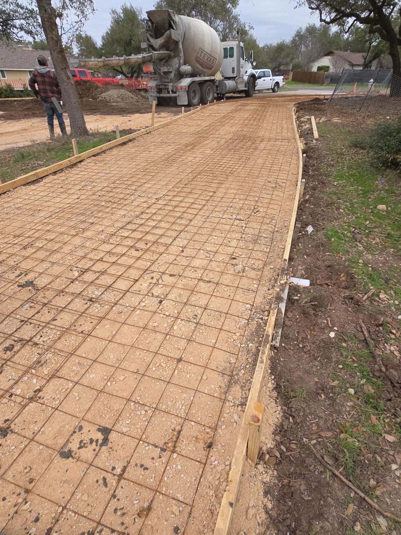 Concrete truck on site with rebar grid ready for pour
