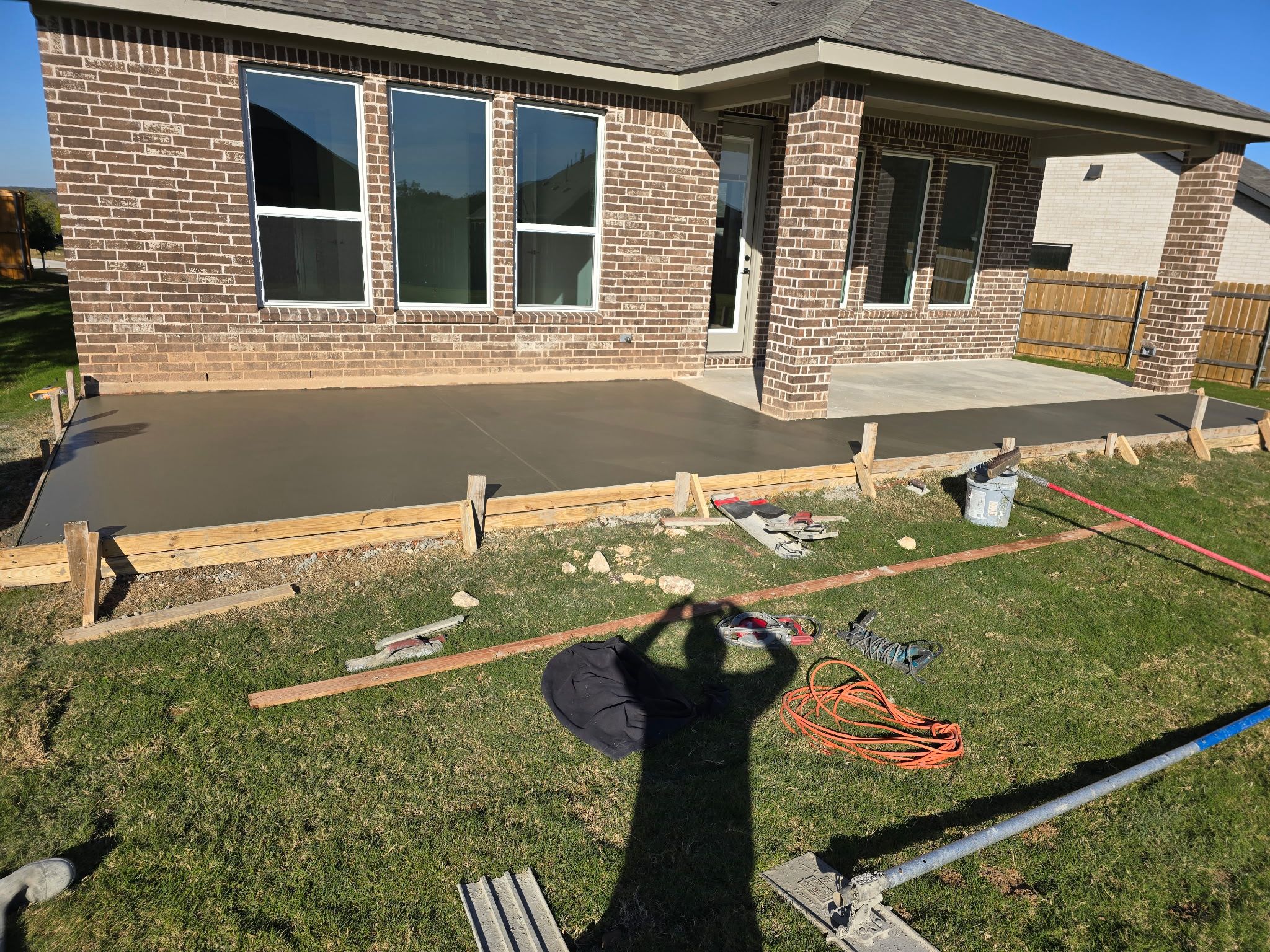 Backyard patio concrete pour with smooth finish