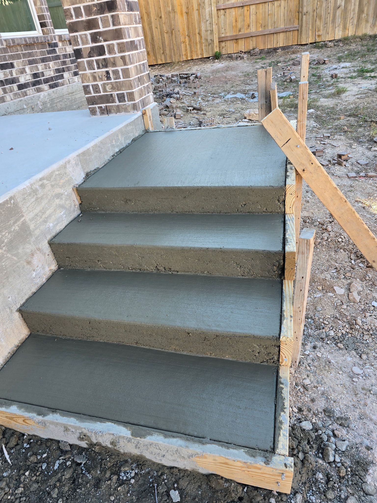 Custom concrete entry steps with clean finish