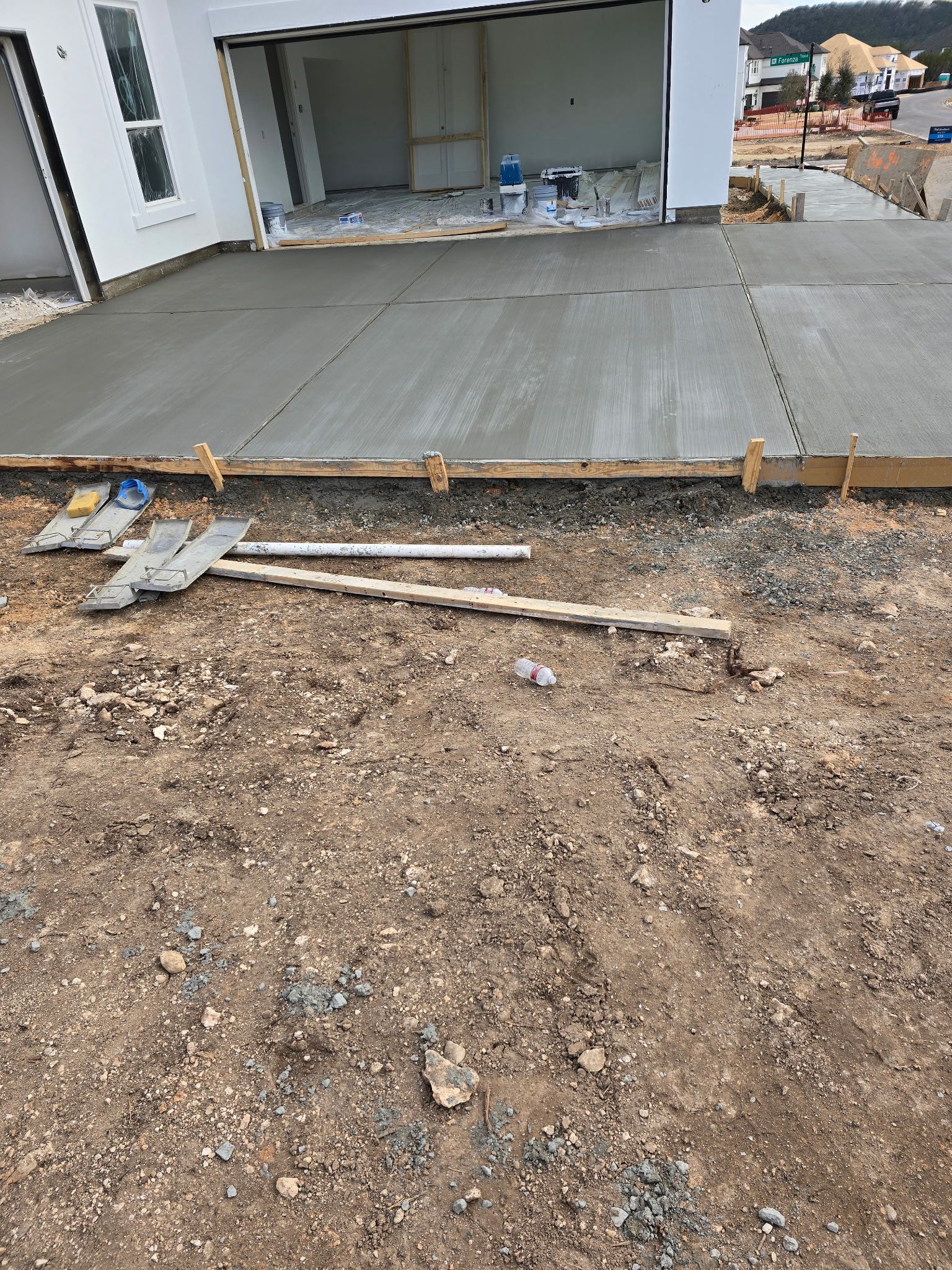 Freshly poured garage slab at new construction