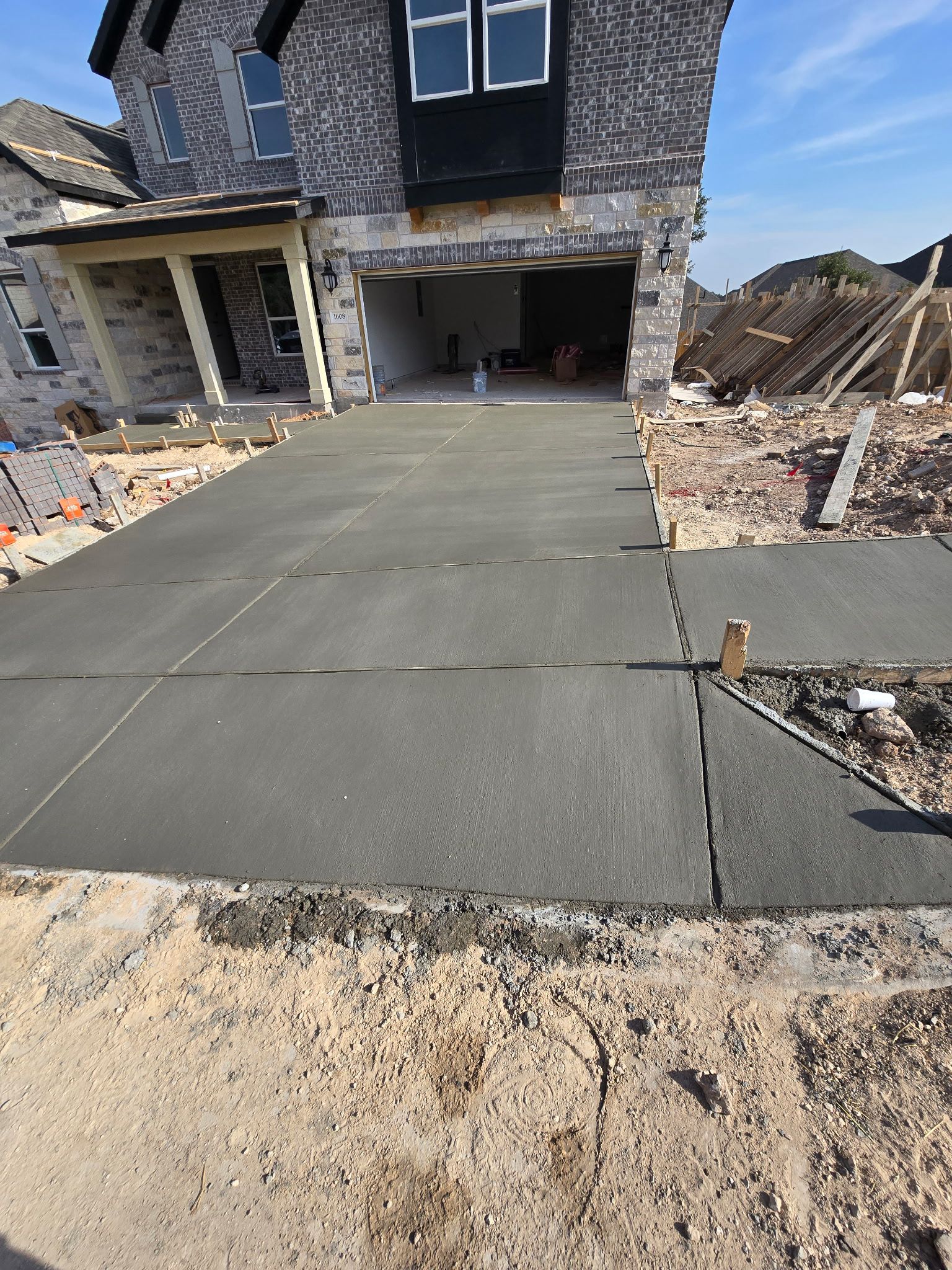 Freshly poured two-car concrete driveway